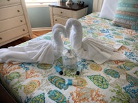 two swans on a bed