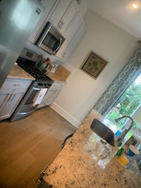 a kitchen with a sink and a refrigerator